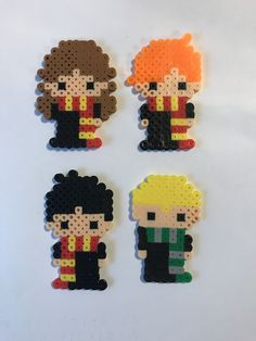 four perler bead magnets depicting the backs of harry potter and ron weasley