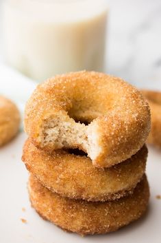 three sugar donuts stacked on top of each other