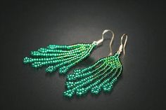 Emerald Boho Earrings Fringe Beaded Earrings Dangle Seed Green Dangle Jewelry With Bead Caps, Elegant Green Dangle Beaded Earrings, Green Earrings With Tiny Beads, Green Tassel Drop Earrings As Gift, Elegant Green Jewelry With Tassels, Elegant Green Tassel Jewelry, Green Tassel Earrings With Beaded Fringe, Green Beaded Fringe Tassel Earrings Gift, Green Beaded Fringe Tassel Earrings