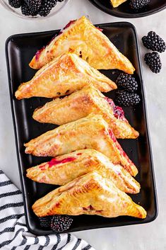 blackberries and raspberry pastries on a plate