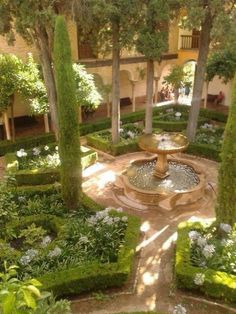 an outdoor garden with trees and plants in it