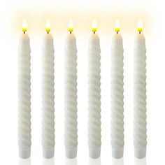 five white candles lined up in a row with yellow lights on each one candle is lit