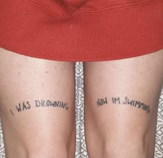 two people with tattoos on their legs that say i was drawing, not i'm swimming