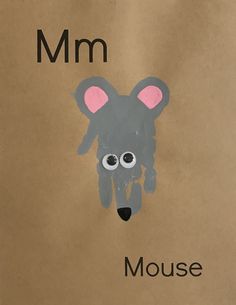 a brown paper bag with a drawing of a mouse on it's face and the word mm