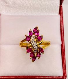 Beautiful Vintage 14k Yellow Gold Natural Ruby Diamond Ring 100% Natural Ruby and Diamonds Beautiful genuine Ruby Ruby: 1.20 CT Diamond(s) 0.05CT Color: G Clarity: SI2 Total ring weight: 5.4GR 14K Yellow Gold Ring sizing available Free of Charge For more information regarding this item feel free to reach me so I can accommodate your needs. Thank you Gold Cluster Ruby Ring Hallmarked, Gold Cluster Ruby Ring, Hallmarked, Cluster Yellow Gold Ruby Ring In Fine Jewelry Style, Yellow Gold Cluster Ruby Promise Ring, Gold Cluster Ruby Ring, Gold Cluster Ruby Ring In 14k, Yellow Gold Cluster Rings With Ruby, Gold Cluster Ruby Ring In 14k Gold, Yellow Gold Ruby Cluster Ring For Promise