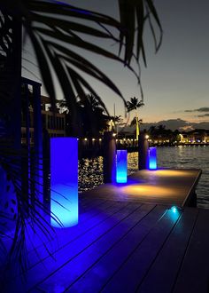 blue lights are lit up on the dock