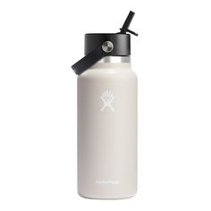 a white hydro flask water bottle with a black lid and handle on the side