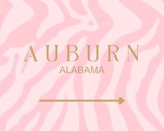 a pink zebra print with an arrow pointing to the word auburn in gold on it