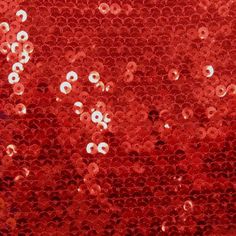 red sequins with white dots are seen in this image taken from the bottom