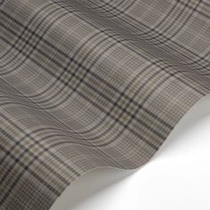 a close up view of the fabric on a white tablecloth with grey and black checkered pattern