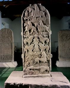 an old stone monument with carvings on it