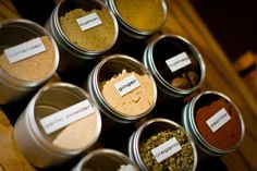 several jars filled with different types of spices