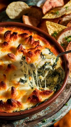 a pizza with cheese and spinach in a bowl