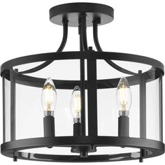 a semi flush ceiling light with three lights on each side and an open cage design