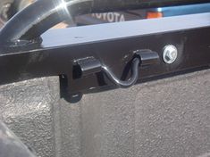 there is a metal handle on the side of a vehicle