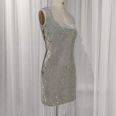 Make a grand entrance in this stunning handmade Crystal Mesh Dress, designed to captivate and shine at every angle. Perfect for a night out, special occasion, or red carpet event, this rhinestone mini dress is the ultimate statement piece. Crafted from premium crystal mesh fabric, it sparkles beautifully under the light, giving you an unforgettable look. The dress features an alluring open-back design that adds a hint of daring elegance, while the lace-up sides offer an adjustable fit that accen Crystal Mesh Dress, Rhinestone Mini Dress, Rhinestone Mini Dresses, Camille Dress, Rhinestone Fabric, Sparkle Party, Mesh Fashion, Dress Luxury, Crystal Fashion