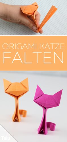 an origami cat made out of folded paper