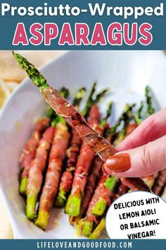 asparagus with lemon and balsamic vinegar in a white bowl, being dipped with prosciutto - wrapped asparagus