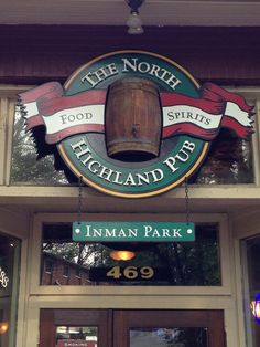 the north highland pub sign is hanging above the entrance to the restaurant's front door