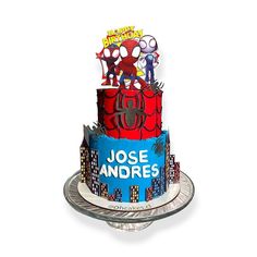 a spiderman themed birthday cake on a plate