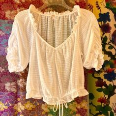 Beautiful Fp Boho Peasant Top, Embellished With Softly Ruched Blouson Sleeves, Ruffle Trim, Elasticized Cuffs & Hem & Adjustable Drawstring At The Bottom. Flirty, Feminine & Super Flattering On. An All Around Versatile Top, Casual Or Dressy Depending On Accessories, Adorable With Jean Shorts, Mini-Skirt Or Flowy Pants. 43% Cotton, 57% Polyester Silky Soft Fabric, Semi-Sheer So Best Worn With A Nude Bra Or Bralette. True To Size, Approx. Bust 21”, Length 22”, Crop Top Style. Nwt Crop Top Style, Boho Peasant Top, Nude Bra, Flowy Pants, Peasant Top, Best Wear, Peasant Tops, Top Casual, Ruffle Trim