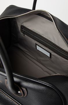 Manufacturing of the grained calfskin enriches the texture with slightly uneven coloring, giving the look of the leather a “vintage” feel. Inside, the accessory is lined in fabric to protect its contents from any potential minimal contact with water. Zip closure Adjustable and detachable shoulder strap Double handle Outside pockets with flap and adjustable strap Water-resistant fabric lining 2 open internal compartments Internal pocket with zip closure All metal parts are Nickel-free Accessory i Mens Weekend Bag, Tuxedo T Shirt, Boutique Online, Elegant Accessories, Sneaker Heels, Small Leather Goods, Brunello Cucinelli, Weekender Bag, Handbag Backpack