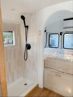 the bathroom is clean and ready to be used as a shower head for the rv