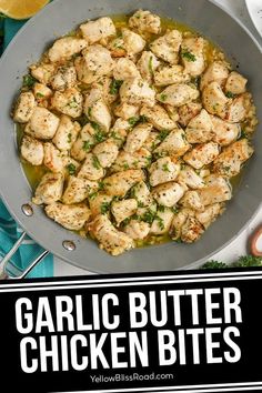 garlic butter chicken bites in a skillet with lemons and parsley on the side