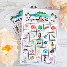 a printable tropical bingo game next to flowers