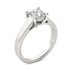 a white gold ring with a princess cut diamond