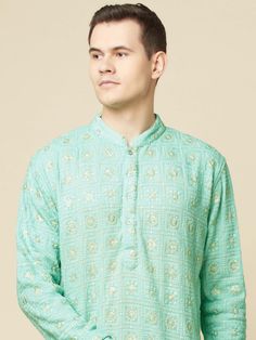 This Mint Green Lucknowi Embroidered kurta will instantly give an elegant look. Made from polyester cotton fabric, this 2 piece kurta set features a mint green lucknowi kurta, front buttons fastening, designer cuff buttons, and a mandarin collar. This mint green kurta has beautiful sequins Jaal thread embroidery work all over. It is paired with white churidar pants. An ideal outfit for traditional & special events.

Size Chart For Men





	
	
					Men's Size Chart
		

		
		
						
				Size Char Lucknowi Kurta, White Churidar, Thread Embroidery, Churidar, Kurta Set, Embroidery Work, Over It, Mandarin Collar, Anarkali