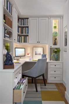 a home office with built in bookshelves and desk