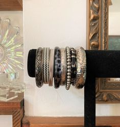 "8/ Stack of Bangles / Black & Silver/ Vintage Bangle Stack / Bangle Lot This stack of coordinated bangles measures almost 4\". Metal, brass, aluminum, and plastic. Via the late 80s and 90s. Wear them layered on a wrist or both or singly :) Note to self: 24 in dwn inv" Silver Bangle Stack, Stackable Vintage Bangle, Black Metal Bohemian Cuff Bracelet, Vintage Black Bangle Cuff Bracelet, Bohemian Black Metal Cuff Bracelet, Adjustable Black Bangle, Black Stackable Bangle Bracelets, Black Cuff Bangle Bracelet, 90s Wear