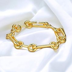 "Indulge in the elegance of our Paperclip Link Chain bracelet, adorned with a luscious yellow coating that exudes luxury. Elevate your style effortlessly by pairing this exquisite bracelet with your cherished outfits, making it an essential addition to your wardrobe. For the ultimate lavish ensemble, complement it with our Paperclip Chain Necklace and embrace a truly opulent look. 18K Yellow Gold Plated 8\" or 20cm 29g Hook in clasp Link to necklace: https://www.etsy.com/listing/1546766597/paperclip-style-wlarge-open-oval-links?click_key=2c5a21297b60a620a8977ea342664e03bd452097%3A1546766597&click_sum=b58b85b7&ref=shop_home_active_2&frs=1" Luxury Oval Link Bracelet With Clasp, Luxury Gold-tone Oval Link Paperclip Bracelet, Luxury Gold-tone Link Jewelry, Luxury Gold Plated Chain Bracelet With Oval Link, Paperclip Chain Necklace, Link Chain Bracelet, Trombone, Lovely Earrings, Chain Link Bracelet