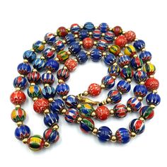 Vintage Venetian Trade Style beads Old Multicolor Chevron Beads Strand This stunning strand of vintage Venetian trade style beads is a must-have for any collector. The beautiful red chevron design adds a pop of color to any jewelry project or home decor display. These beads are handmade with exquisite glass material, showcasing the craftsmanship and attention to detail from artisans of the time period. The origin of these beads is African, adding to their unique and cultural value. These colle Festive 8mm Round Bead Necklace, Vintage Multicolor Spacer Beads, Traditional Multicolor 8mm Beads Jewelry, Traditional Multicolor 8mm Beaded Jewelry, Traditional Multicolor 8mm Bead Jewelry, Vintage Multicolor Large Beads, Traditional Multicolor Jewelry With 8mm Beads, Festive Multicolor Spacer Beads, Elegant Multicolor Beaded Necklace With 8mm Beads