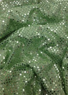 Sage color sequins disco dots trans knit confetti 16 colors available sold per yard 44 inches wide. (sequined area is 36 inches wide, the margins are the base fabric). We have posted other listings for the rest of the 16 colors. Please look for them in our Etsy shop.  This fabric has shiny 3mm sequins evenly spaced all over the fabric. The sequins are the same color as the fabric. The sequins are reflective and create a beautiful shimmering effect with light. This fabric has a high quality mesh Holiday Disco Sequin Fabric With Glitter, Green Sequin Fabric For Festive Party, Green Sequin Fabric For Party And Festive Occasions, Disco Style Sequin Fabric For Festive Party Season, Disco Style Sequin Fabric For Party Season, Summer Festive Sequin Fabric With Glitter, Disco Glitter Sequin Fabric For Party Season, Shiny Sequin Fabric For Party Season, Disco Sequin Fabric For Party Season