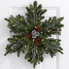 a christmas wreath hanging on the front door