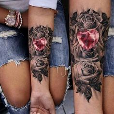 two women's legs with tattoos and roses on them