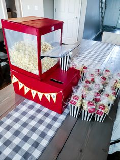 a table topped with boxes filled with popcorn