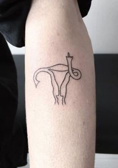 a woman's arm with a tattoo on it that has an image of a horse