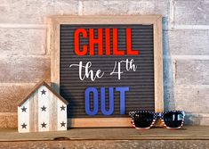 a sign that says chill the 4th out next to some sunglasses and a dog house