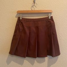 New With Tags. Wild Fable Womens Size Extra Small Skater Tenis Box Pleats Skirt Color Brown. Materials Include Polyester, Rayon, And Spandex. Semi A-Line Style Mini Skirt With Zipper Closure. Makes For A Cute Outfit For Any Season. Approximate Measurements: Waist: 14.5 Inches Length: 15 Inches Thank You! Brown Skirt For School Spring Season, Retro Pleated Bottoms For School, High Waist Brown Pleated Mini Skirt, Brown High Waist Pleated Mini Skirt, Retro Pleated School Bottoms, Brown High-waist Pleated Mini Skirt, Fitted Brown Pleated Tennis Skirt, Casual Fitted Brown Pleated Skirt, High Waist Pleated Brown Skort