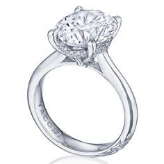 a diamond engagement ring on a white background