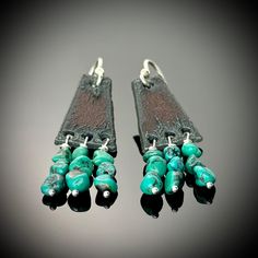 These super cute and rustic southwestern earrings are made with natural turquoise pebbles, wire wrapped in sterling silver, and dangling from rusted iron triangular trapezoid shaped components. The ear wires are sterling silver and the earrings measure 2 1/8 inches long. They are simple, casual, lightweight, and comfortable to wear. Pair them with jeans and a t-shirt, a flowy bohemian dress, or a fringed suede skirt for a boho cowgirl/native American vibe.💠🤎 Length: 2 1/8 inches (53mm) Width: just over 1/2 inch (14mm) Materials: Turquoise, Rusted Iron, Sterling Silver All jewelry from Penny's Treasures is handcrafted with love and soul and my own two hands in my home studio deep in the heart of Texas. Each piece will arrive packaged in a lovely gift box wrapped with a ribbon, ready for g Flowy Bohemian Dresses, Pebble Earrings, Southwestern Earrings, Bohemian Cowgirl, Western Style Turquoise Nickel-free Earrings, Western Style Nickel-free Turquoise Earrings, Artsy Nickel-free Turquoise Earrings, Bohemian Turquoise Hand-tooled Earrings, Nickel-free Turquoise Southwestern Earrings