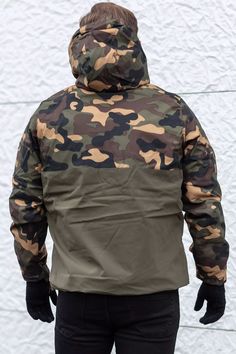 Real men won’t get around this jacket. With its sporty cut, functional design and the trendy camo pattern it knows to convince at first glance. The pullover jacket is the ideal choice for cold days and in-between weather. For maximum protection you will find a high collar, hood with drawstring closure as well as adjustable cuffs beneficial. Furthermore, the jacket is made from a reliable material and is therefore suitable for either urban or outdoor terrain. Military Hooded Outerwear For Sports, Military Style Camouflage Windbreaker For Outdoor, Camouflage Military Windbreaker For Outdoor, Military Camouflage Windbreaker For Outdoor, Camouflage Windbreaker With Pockets For Outdoor Activities, Camouflage Hooded Jacket With Adjustable Hood For Streetwear, Military Camouflage Hooded Jacket For Outdoor Activities, Military Camouflage Hooded Jacket For Outdoor, Military Style Camouflage Hooded Jacket For Outdoor Activities