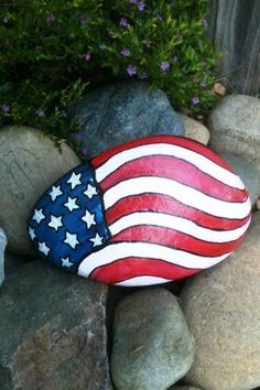 a painted rock with an american flag on it