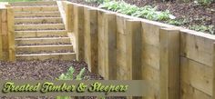 a wooden fence and steps with plants growing on them in the background, text reads treated timber & slats