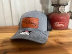 It's more than just a hat! Use your kids handwriting to make a custom patch for a thoughtful and personalized Father's Day, birthday, or Christmas gift for dad, grandpa, or any other special man in your life! 🤩 We have matching Richardson 112 hats in adult and youth.  Custom Handwriting:  Write handwriting on a solid white sheet of paper with a sharpie and send it to us through Etsy messages or email to hubcityhats@gmail.com.  If you don't see a color you like listed, please message us! We can Cheap Personalized Hats For Father's Day, Casual Trucker Hat For Father's Day, Letter Print Hat For Father's Day Gift, Father's Day Gift Trucker Hat With Curved Brim, Father's Day Gift Hats With Letter Print, Personalized Casual Trucker Hat For Father's Day, Personalized Hats For Father's Day, Leather Patch Cap As A Gift, Leather Patch Cap - Gift