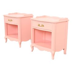 two pink nightstands sitting next to each other