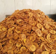 a pile of dried bananas sitting on top of a counter